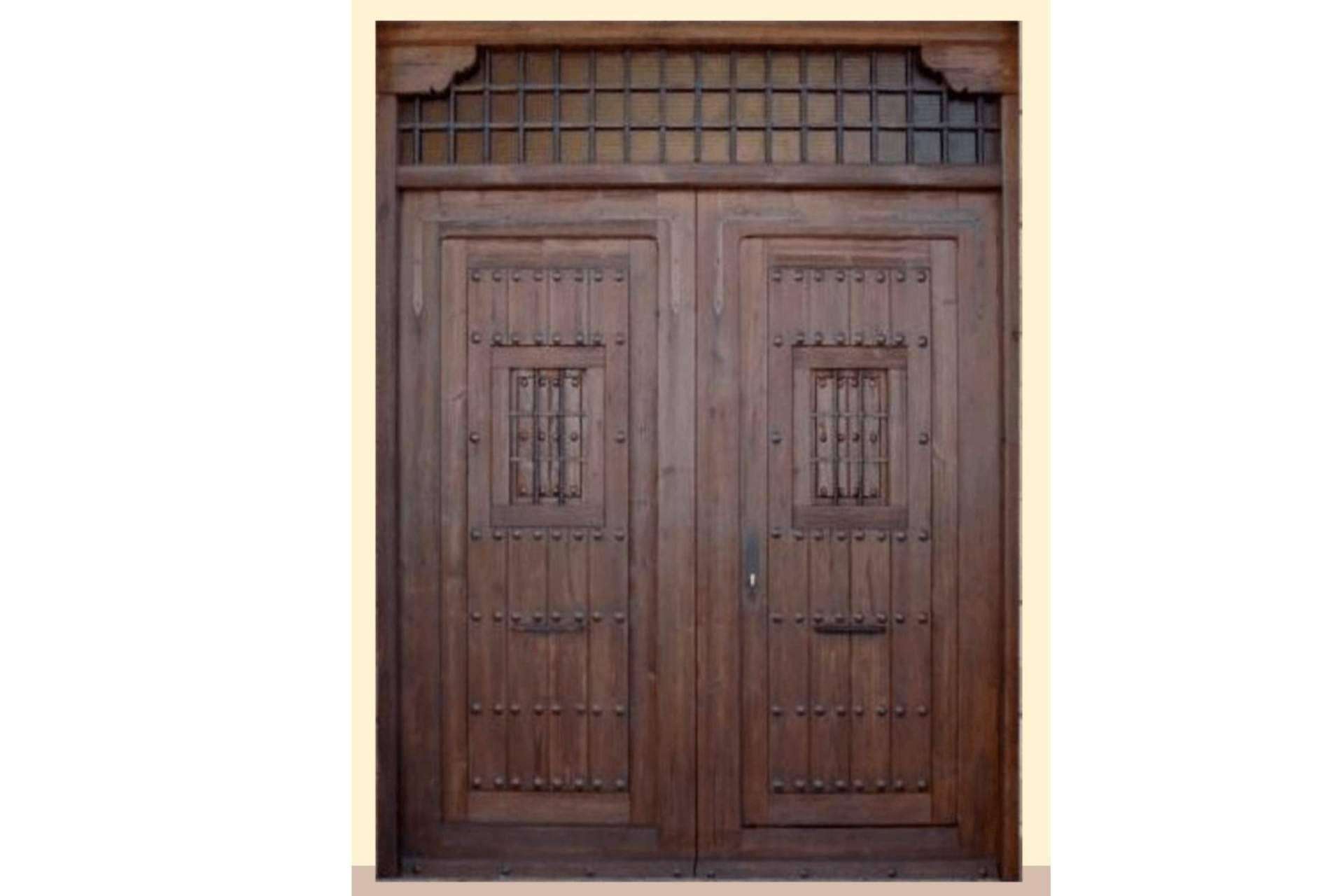 La puerta rústica exterior es la opción perfecta para la decoración de fincas, por Losma Studio