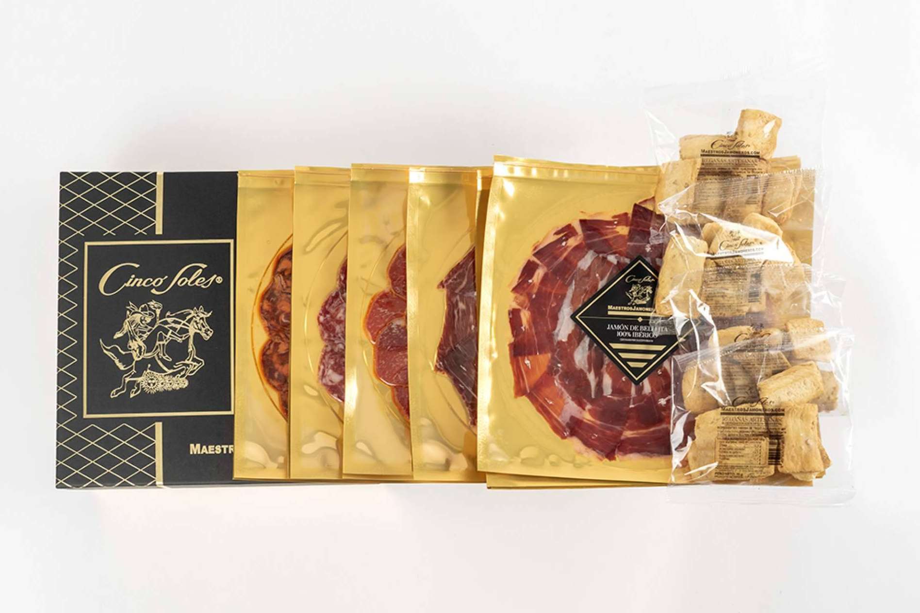 Maestros Jamoneros y sus lotes de Jamón de Bellota ibéricos cortados a cuchillo, uno de los regalos corporativos más buscados para esta Navidad